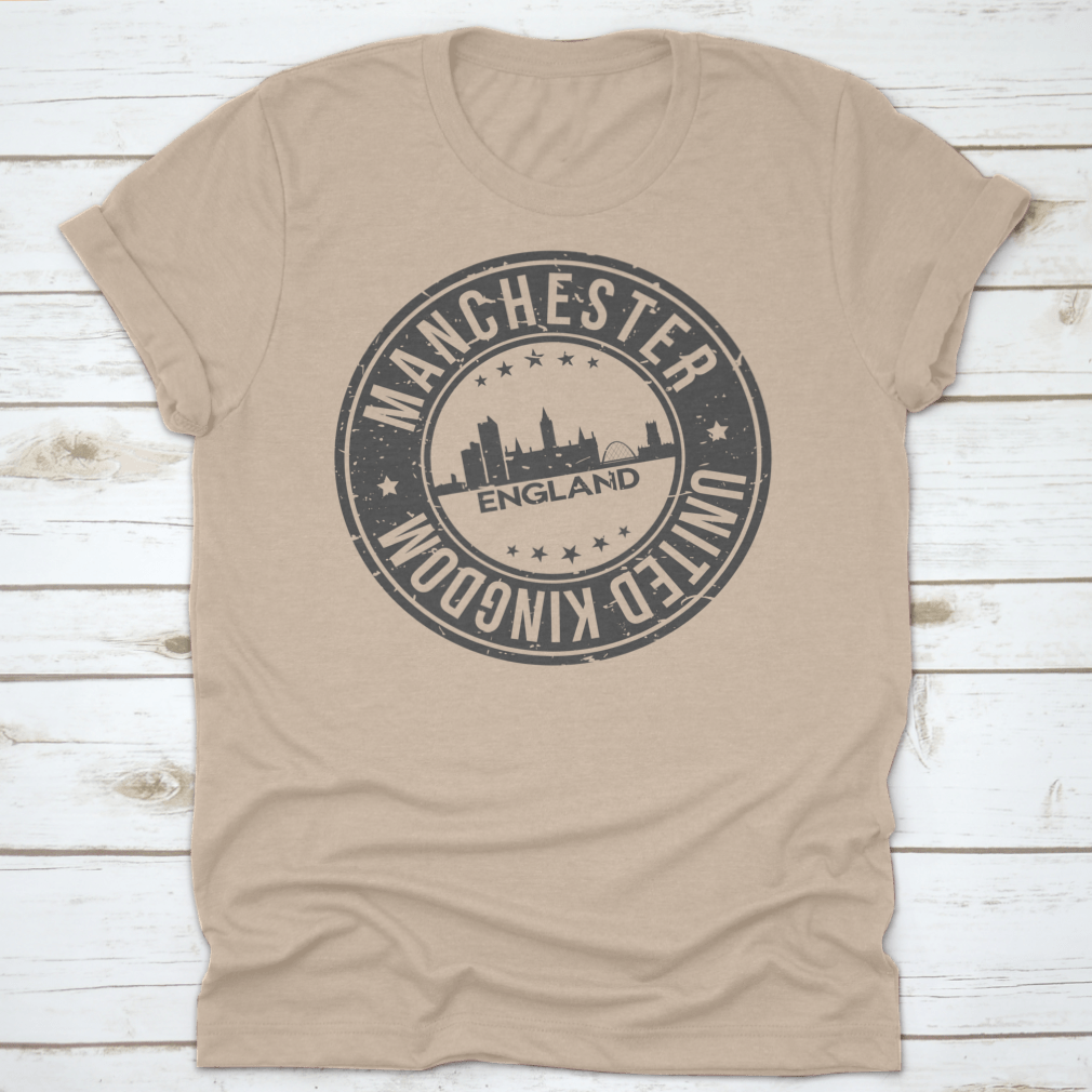 A stylish T-shirt featuring the Manchester England stamp logo, made from 100% cotton with a classic fit.