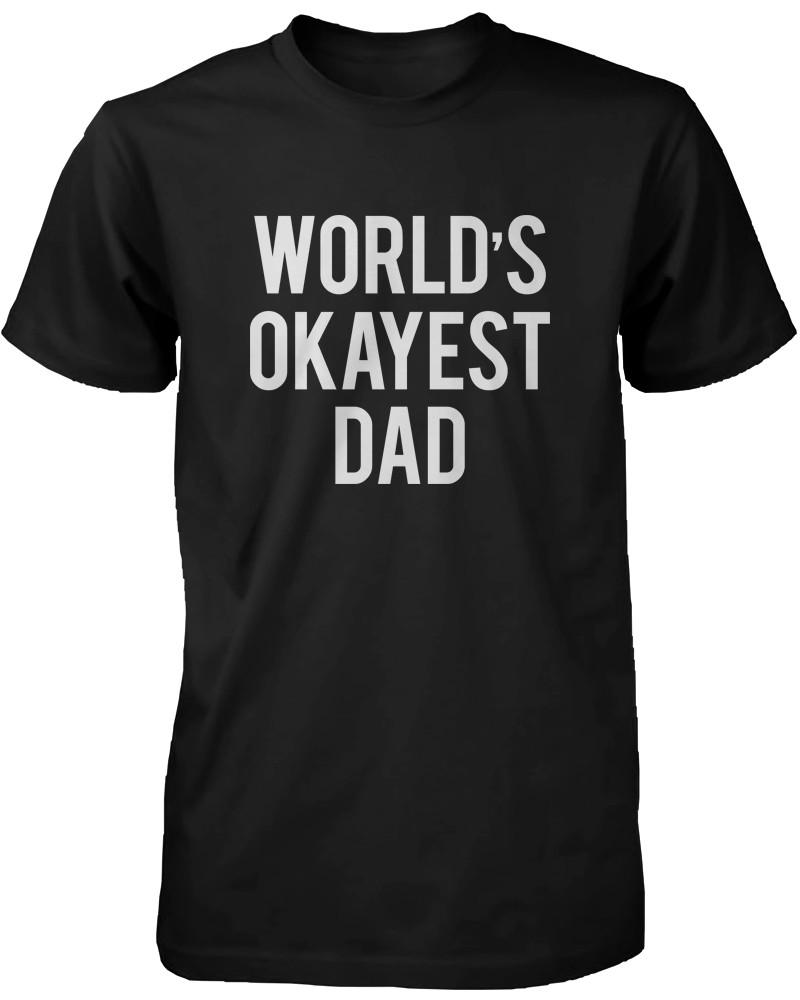Men's black t-shirt with a humorous graphic saying 'World's Okayest Dad', made from 100% cotton.