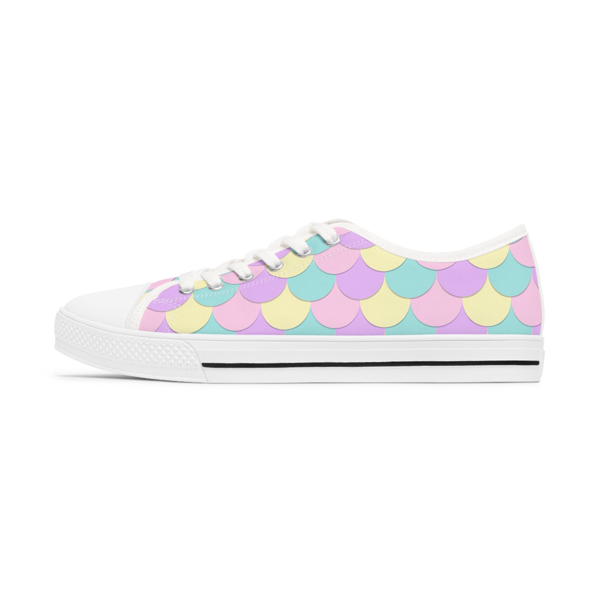 A pair of Mermaid Scales Women's Low Top Sneakers featuring a vibrant mermaid scale design, breathable canvas, and stylish lace-up closure.