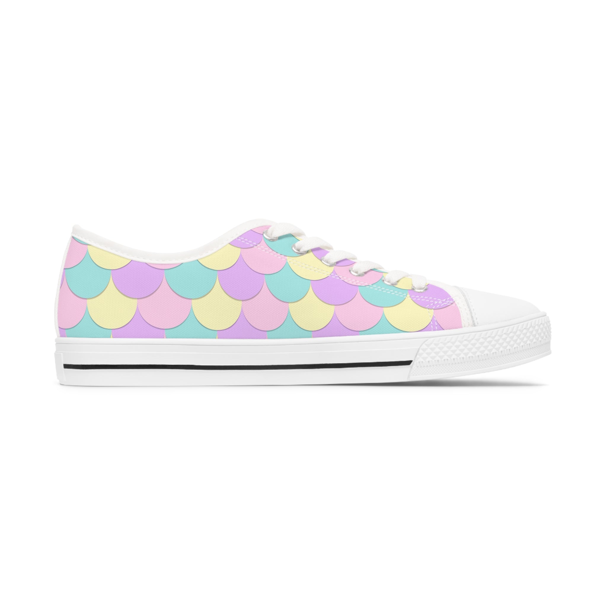 A pair of Mermaid Scales Women's Low Top Sneakers featuring a vibrant mermaid scale design, breathable canvas, and stylish lace-up closure.