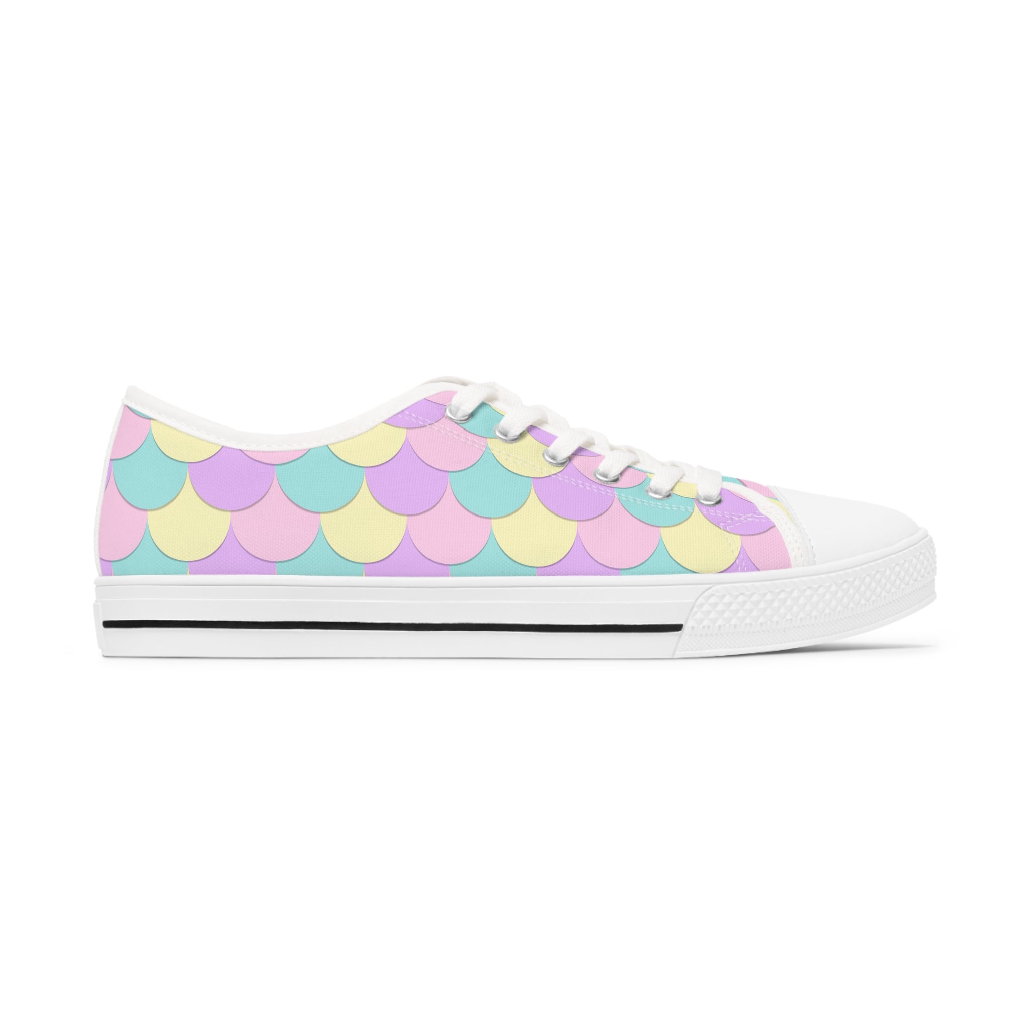 A pair of Mermaid Scales Women's Low Top Sneakers featuring a vibrant mermaid scale design, breathable canvas, and stylish lace-up closure.
