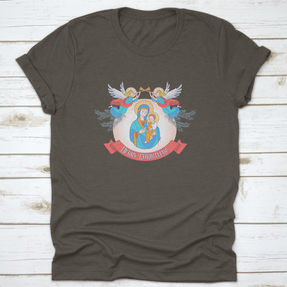 A festive t-shirt featuring Blessed Mary in a blue tunic holding Baby Jesus, perfect for Christmas celebrations.