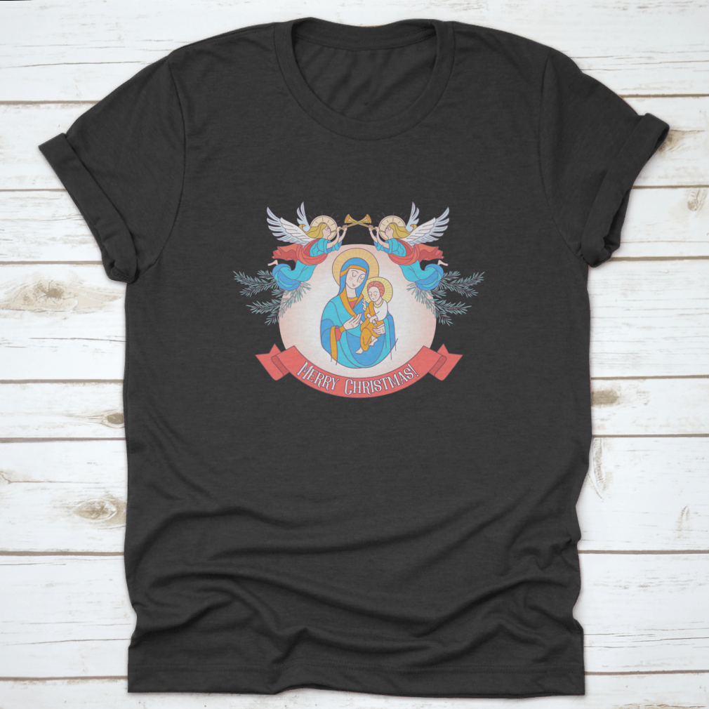 A festive t-shirt featuring Blessed Mary in a blue tunic holding Baby Jesus, perfect for Christmas celebrations.