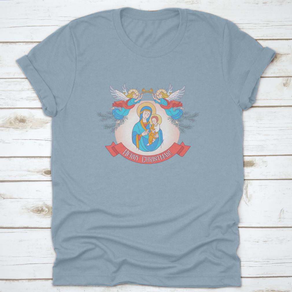 A festive t-shirt featuring Blessed Mary in a blue tunic holding Baby Jesus, perfect for Christmas celebrations.