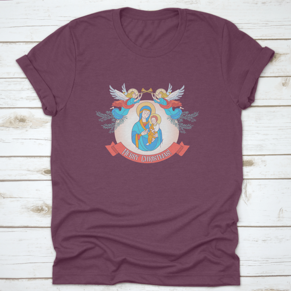A festive t-shirt featuring Blessed Mary in a blue tunic holding Baby Jesus, perfect for Christmas celebrations.