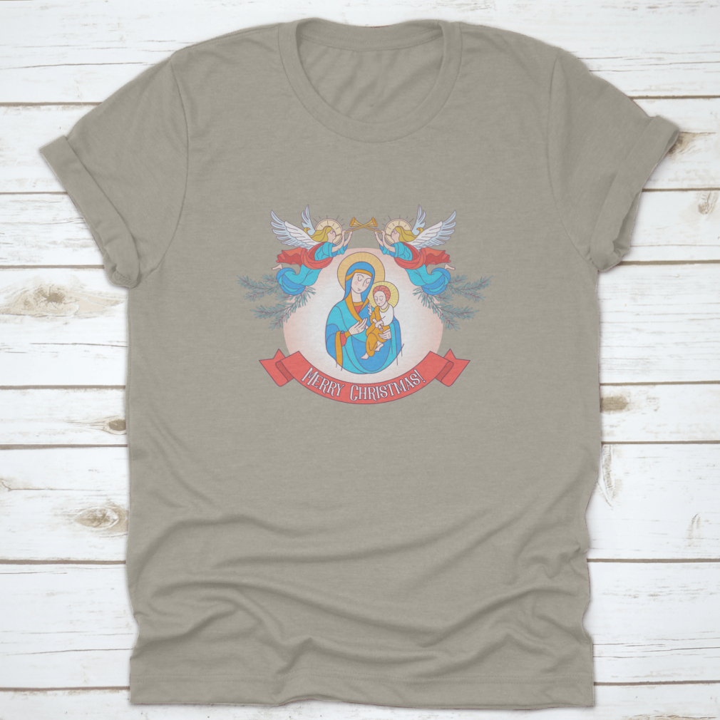 A festive t-shirt featuring Blessed Mary in a blue tunic holding Baby Jesus, perfect for Christmas celebrations.