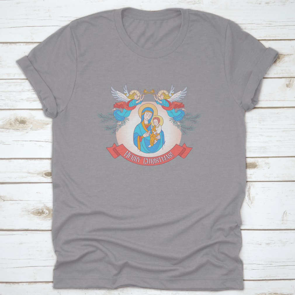 A festive t-shirt featuring Blessed Mary in a blue tunic holding Baby Jesus, perfect for Christmas celebrations.