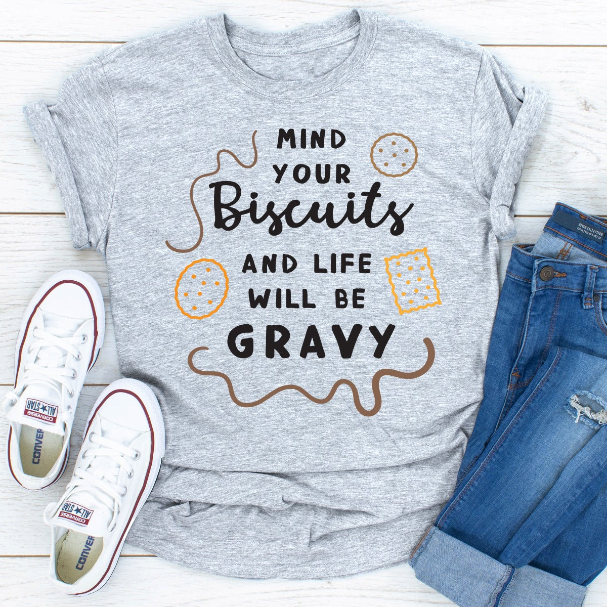 Mind Your Biscuits And Life Will Be Gravy T-Shirt in various colors, showcasing its soft fabric and durable stitching.