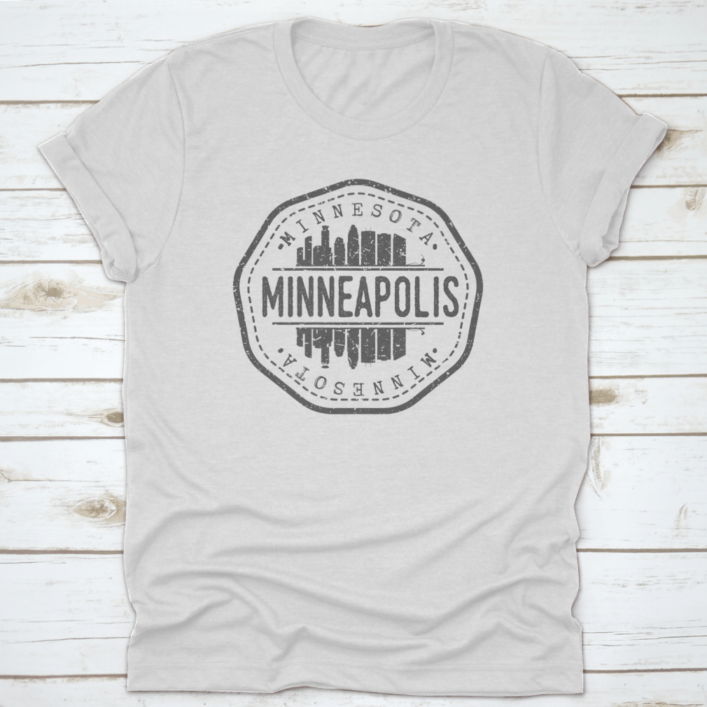 Minneapolis Skyline Stamp Postmark T-Shirt showcasing a silhouette design on a soft cotton fabric.