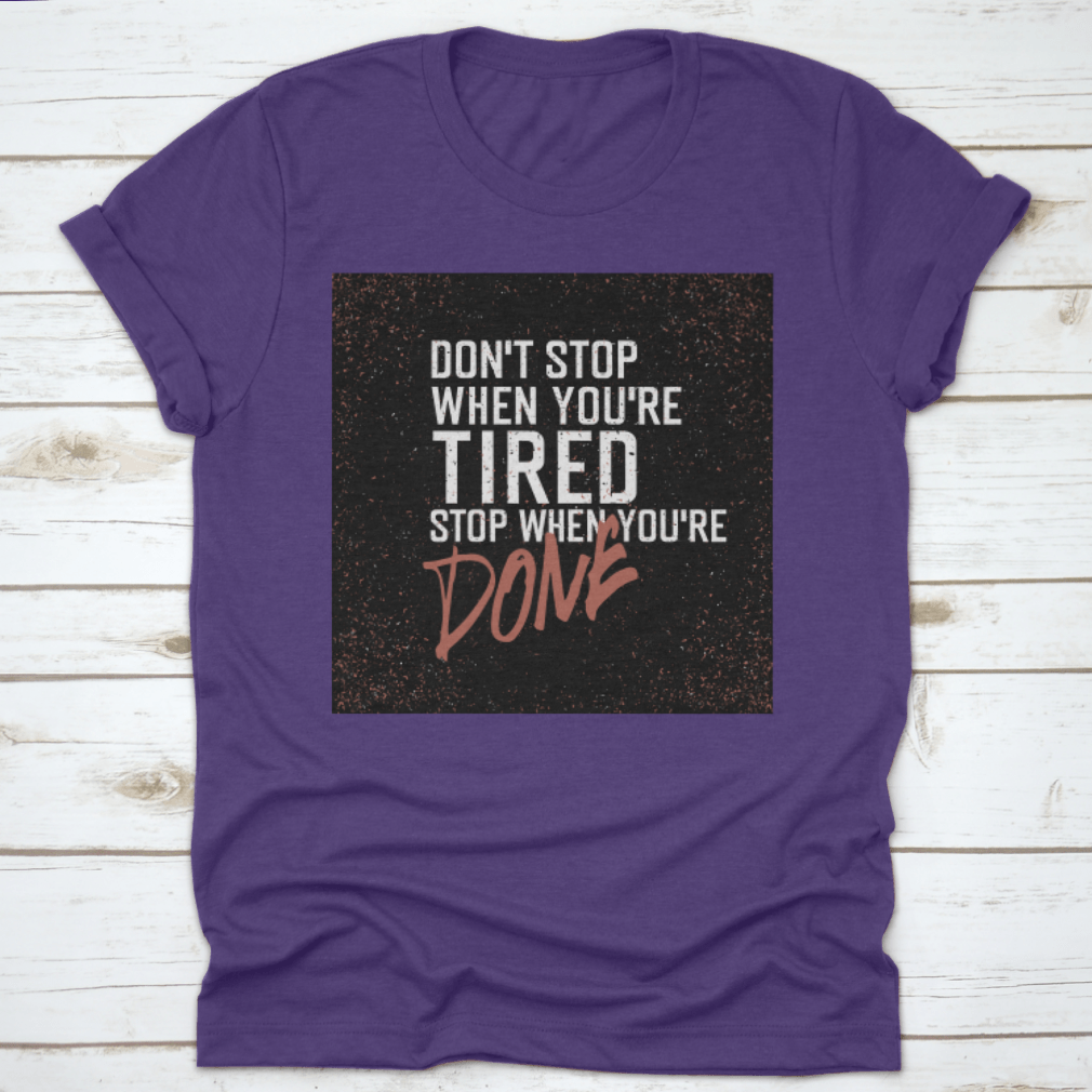 Motivational poster with the quote 'Don't Stop When You're Tired. Stop When You're Done.' displayed in a modern setting.