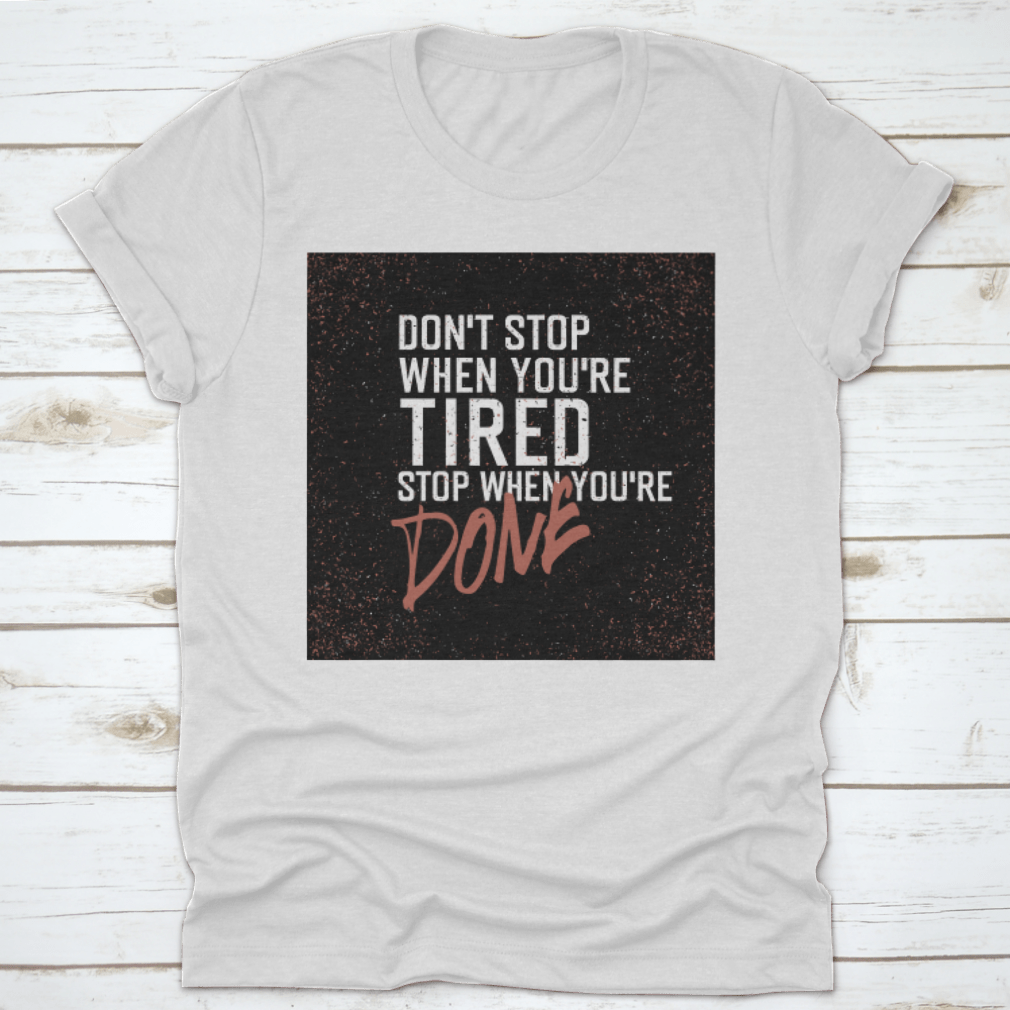 Motivational poster with the quote 'Don't Stop When You're Tired. Stop When You're Done.' displayed in a modern setting.