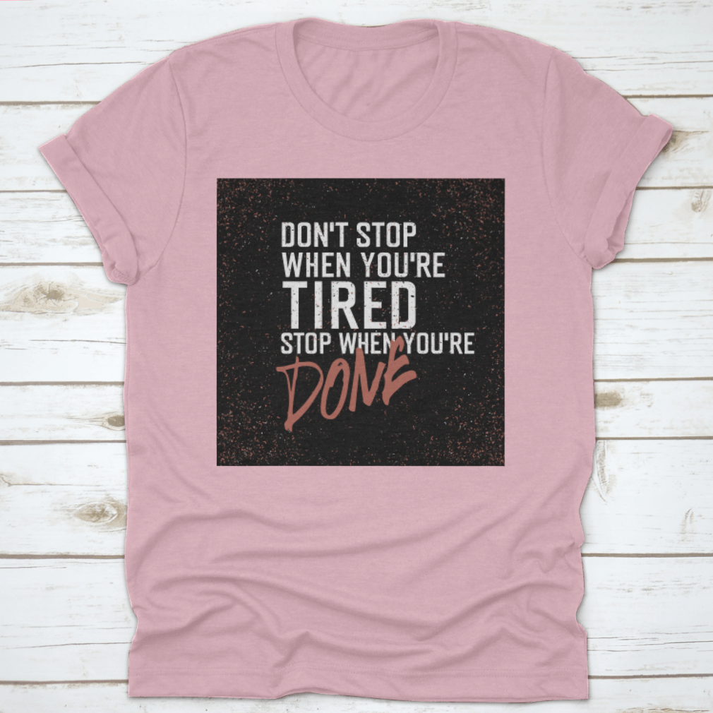Motivational poster with the quote 'Don't Stop When You're Tired. Stop When You're Done.' displayed in a modern setting.