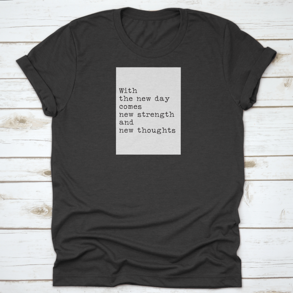 Motivational quotes apparel featuring the phrase 'With A New Day Comes New Strength', made from soft cotton fabric.