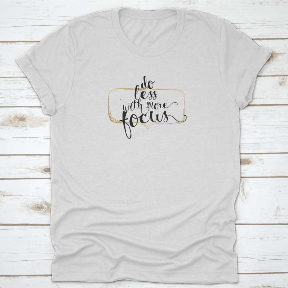 A motivational shirt featuring the quote 'Do Less' in a simple cursive font, made from soft cotton fabric.