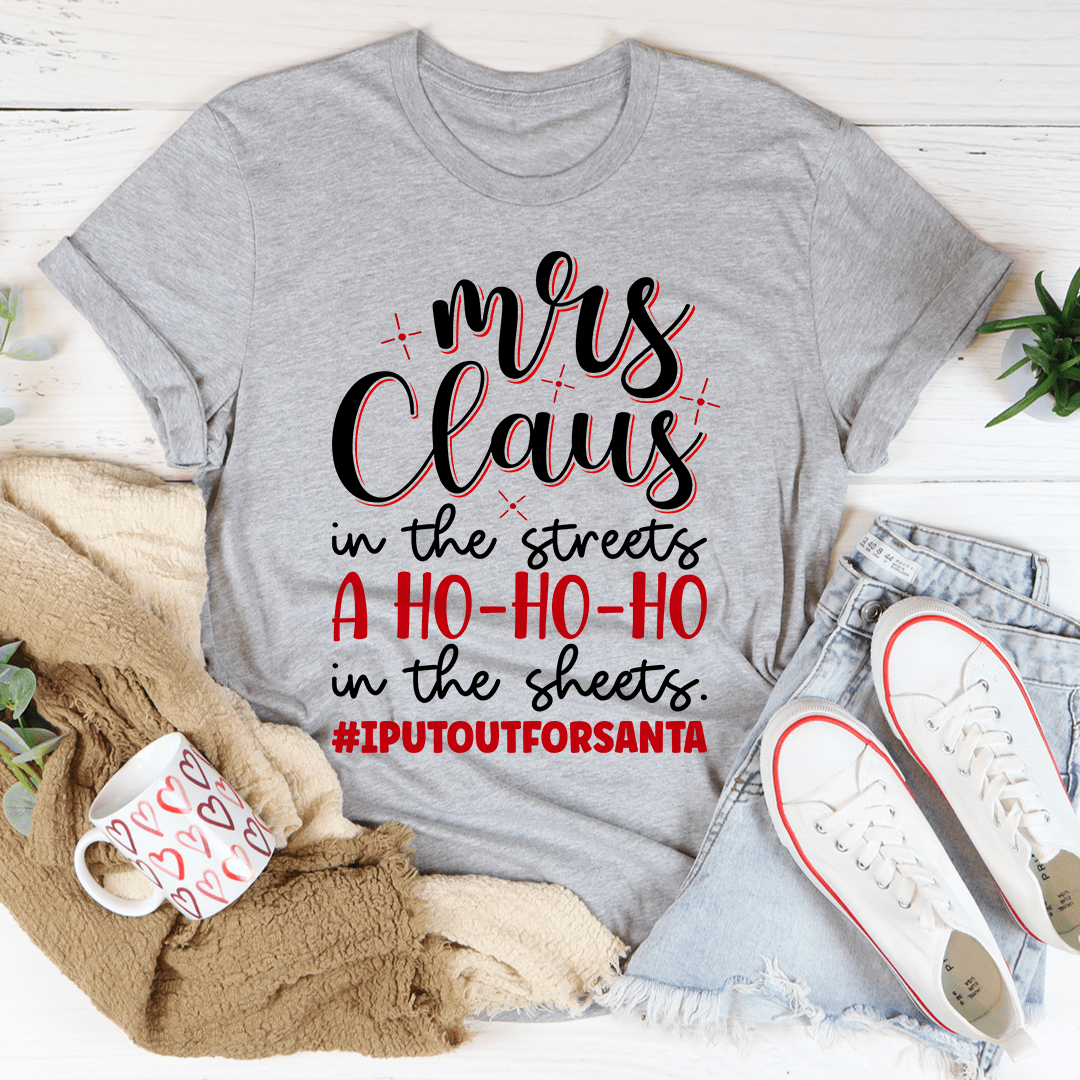 Mrs Claus Tee featuring a festive design, made from 100% soft cotton, perfect for holiday celebrations.