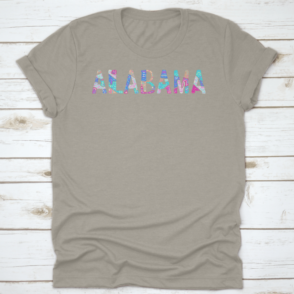 A colorful T-shirt featuring a bright doodle pattern with curves and crooked letters, showcasing a playful and artistic design.