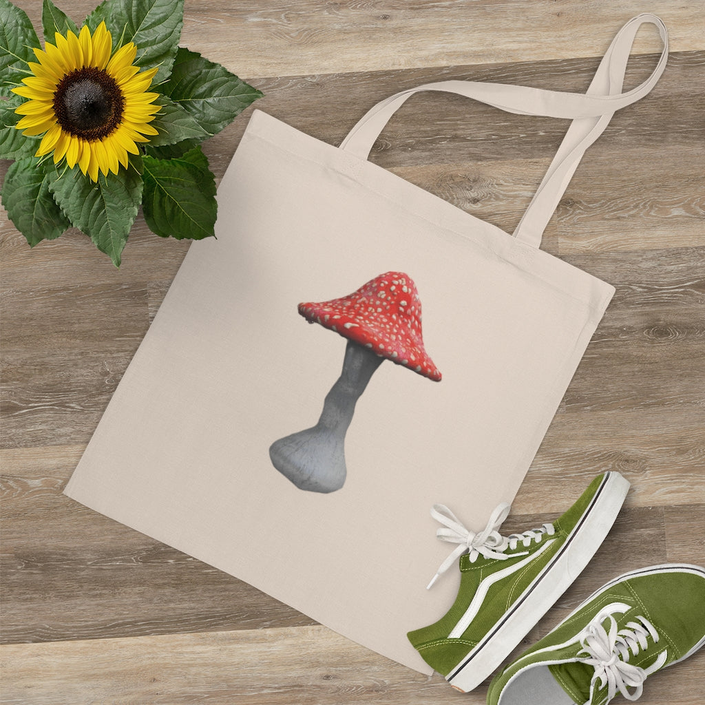 A colorful Mushroom Tote Bag made of 100% cotton with long handles and cross stitching for added stability.