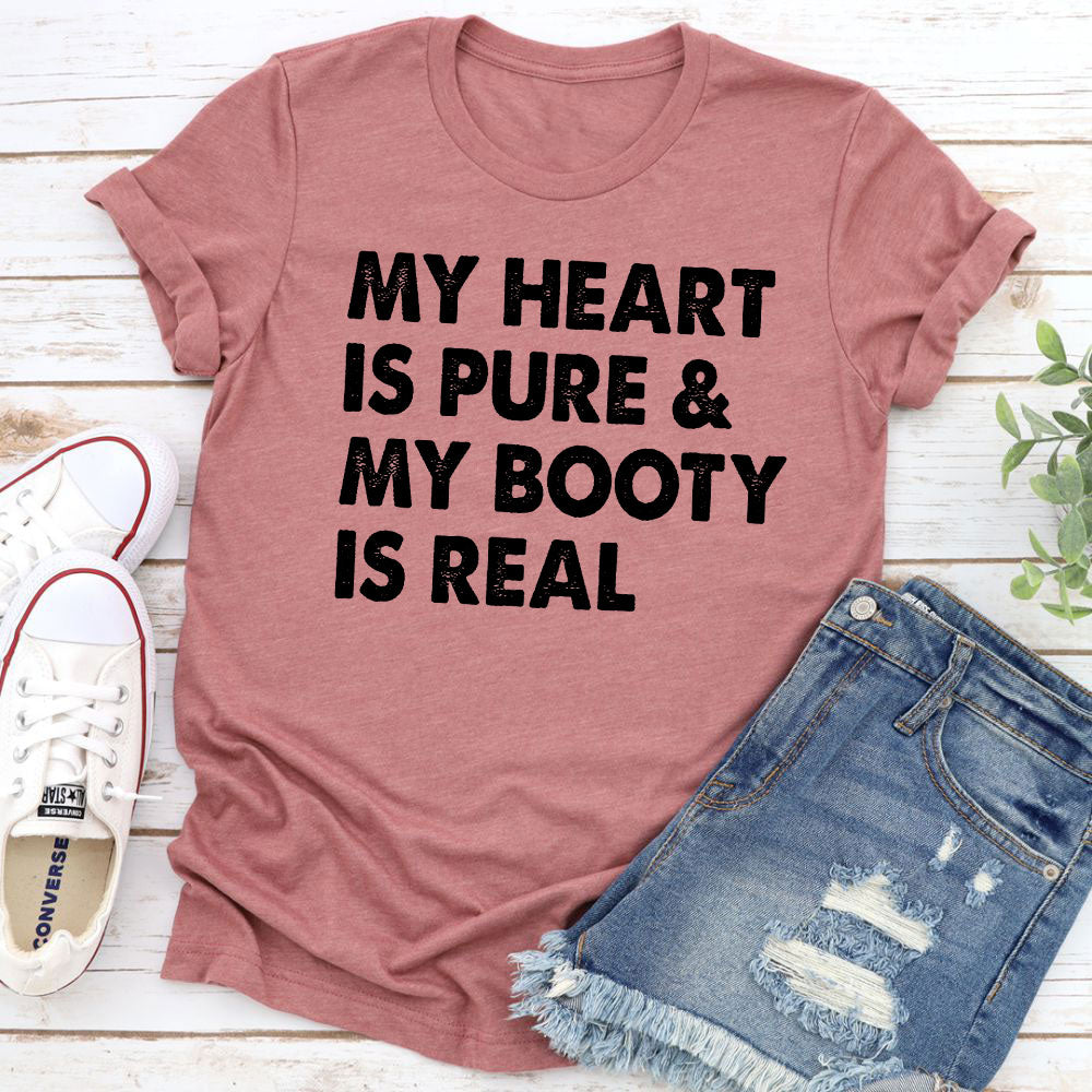 A stylish t-shirt featuring the phrase 'My Heart Is Pure & My Booty Is Real', made from soft cotton with double stitching.