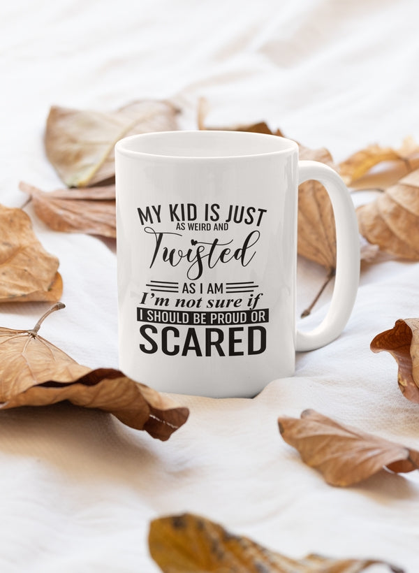 A quirky ceramic mug with the phrase 'My Kid Is Just As Weird And Twisted' printed on it, featuring a glossy finish and sturdy handle.