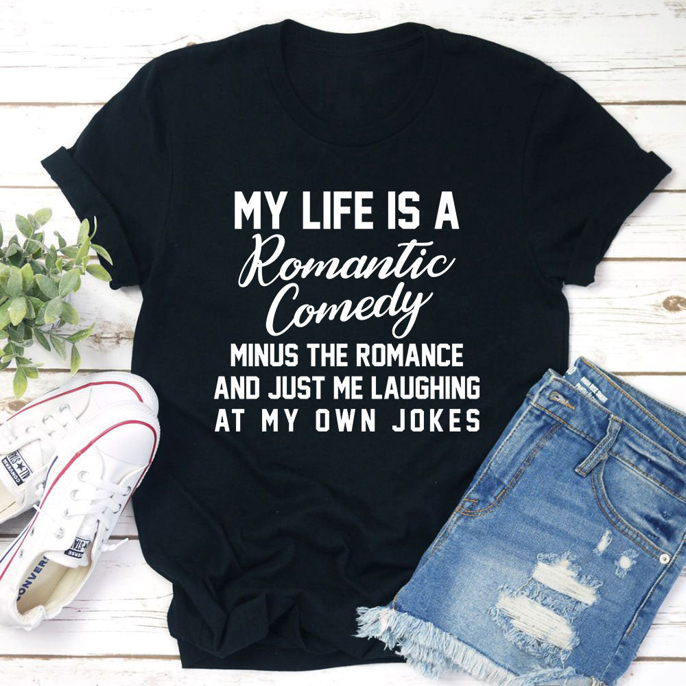 A soft, comfortable t-shirt featuring the phrase 'My Life Is A Romantic Comedy' printed in a stylish font, showcasing its durable double stitching.