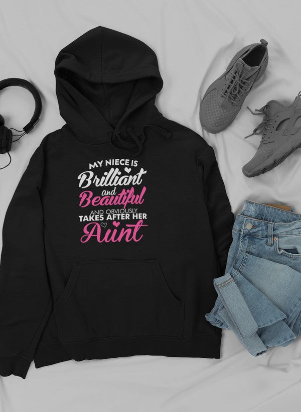 A stylish hoodie featuring unique artwork celebrating brilliance and beauty, designed for comfort with an adjustable hood.