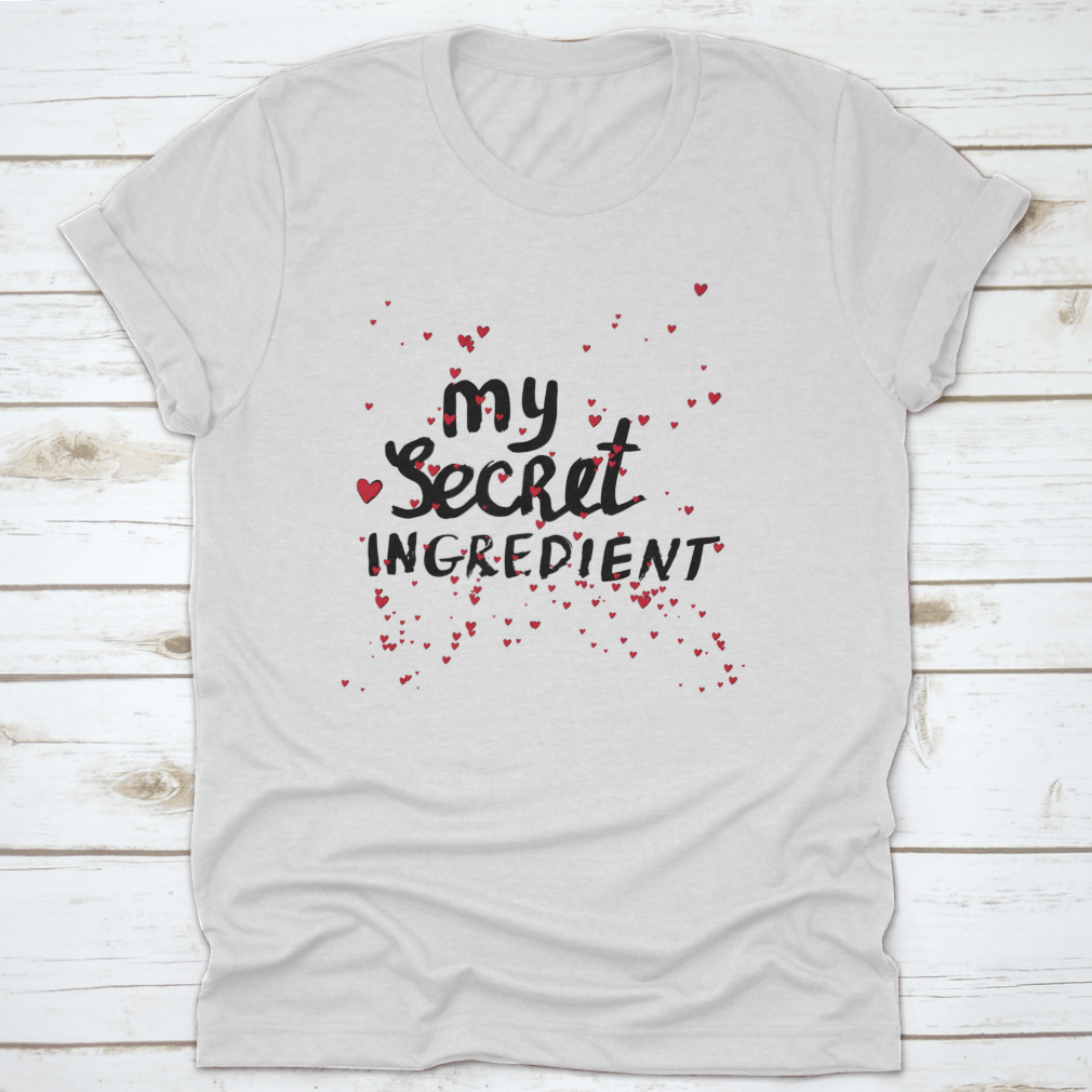 A stylish white shirt featuring hand lettering with red hearts, showcasing a unique and playful design.