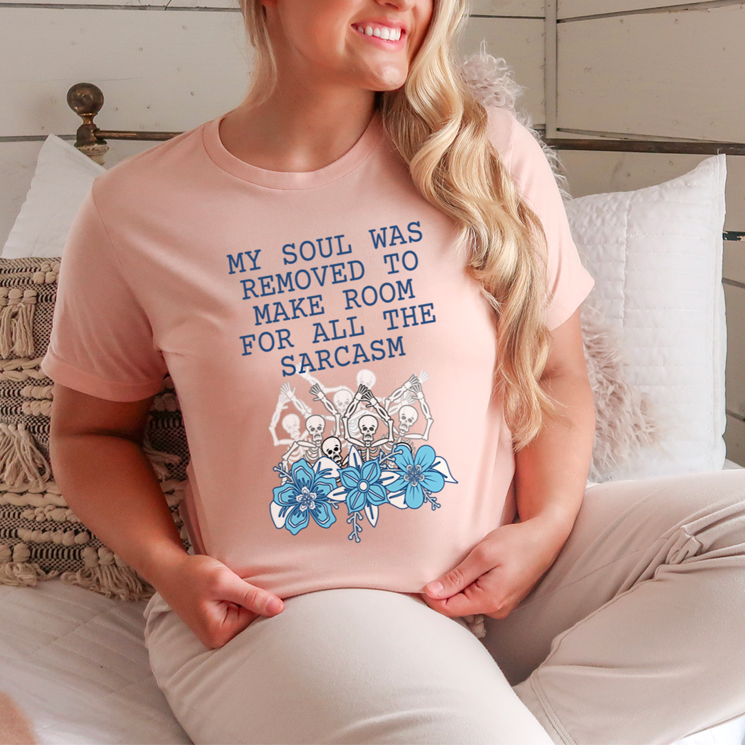 A humorous t-shirt featuring the phrase 'My Soul Was Removed To Make Room For All The Sarcasm', made from soft cotton.