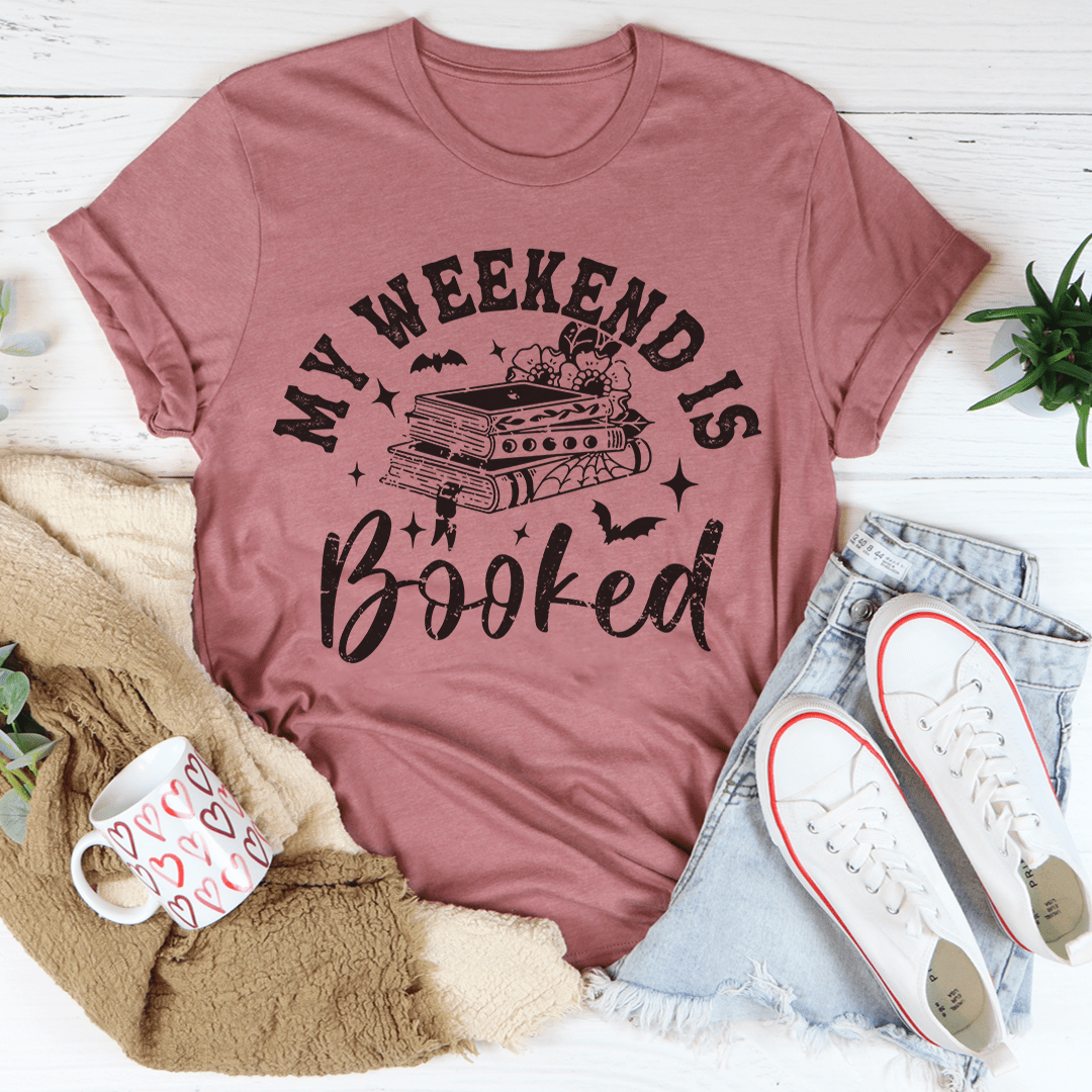 My Weekend Is Booked Tee featuring vibrant Halloween-themed digital print on soft cotton fabric.