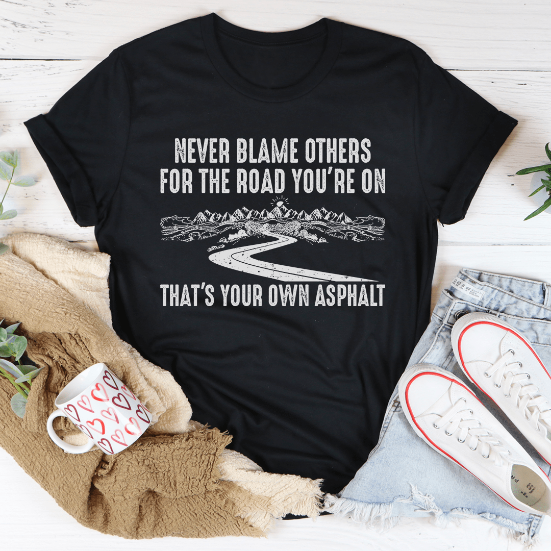 A stylish Never Blame Others T-Shirt made from soft ring-spun cotton, featuring double stitching for durability.