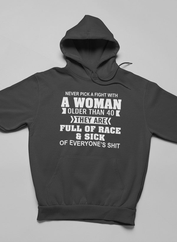 A stylish hoodie featuring the phrase 'Never Pick A Fight With A Woman Older Than 40', made from soft cotton/poly fleece blend.