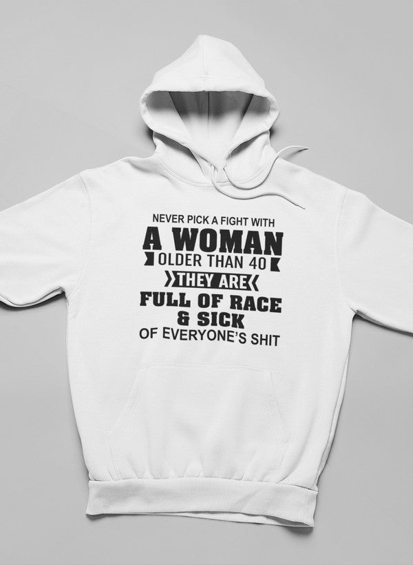 A stylish hoodie featuring the phrase 'Never Pick A Fight With A Woman Older Than 40', made from soft cotton/poly fleece blend.