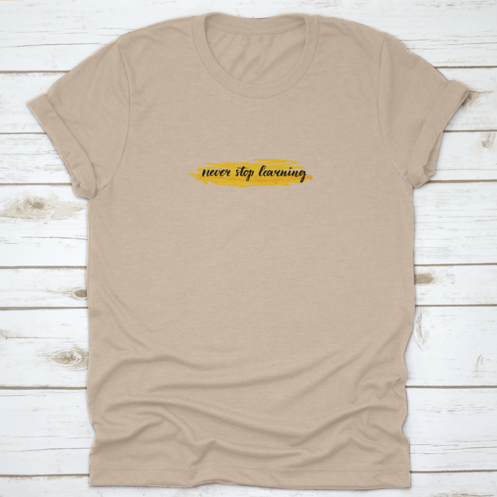 A motivational t-shirt featuring the quote 'Never Stop Learning' designed for comfort and style, made from high-quality cotton.