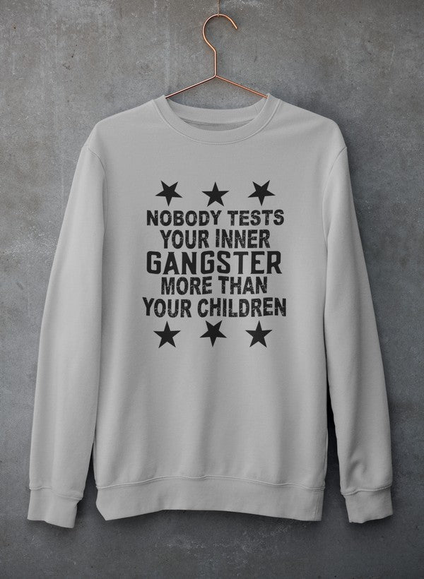 Cozy sweatshirt featuring the phrase 'Nobody Test Your Inner Gangster More Than Your Children', made from cotton/poly fleece blend.