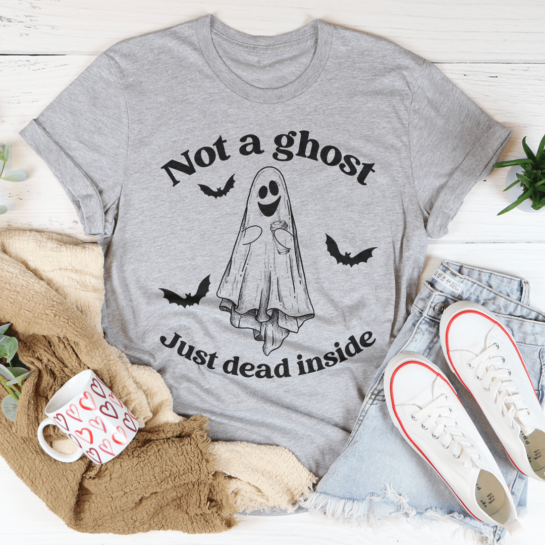 A black Halloween tee featuring the phrase 'Not A Ghost Just Dead Inside' in spooky font, made from 100% soft cotton.