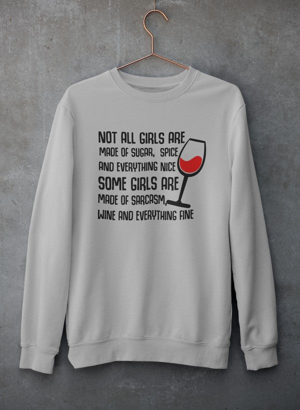 A stylish sweatshirt featuring the phrase 'Not All Girls Are Made Of Sugar And Spice And Everything Nice', designed for comfort and warmth.