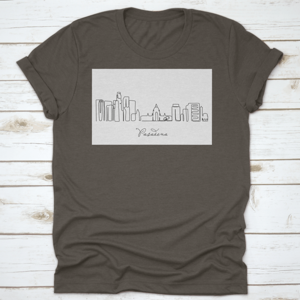 A stylish T-shirt featuring a continuous single line drawing of the Pasadena City skyline, showcasing its iconic buildings and structures.