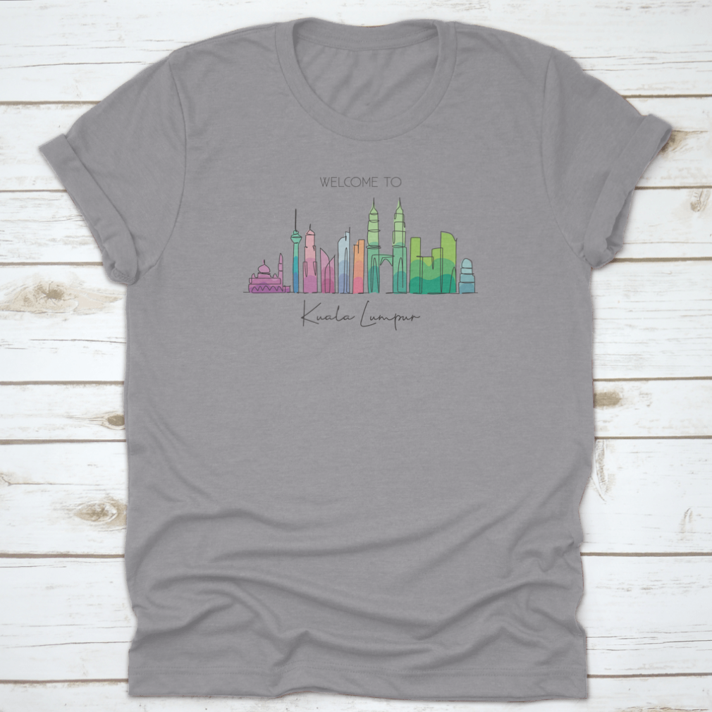 A stylish t-shirt featuring a minimalist single line drawing of the Kuala Lumpur city skyline, showcasing iconic buildings.
