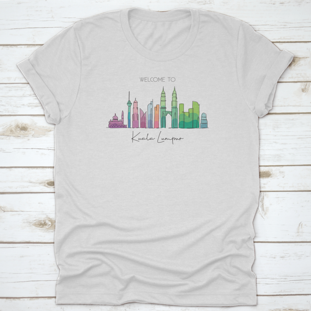 A stylish t-shirt featuring a minimalist single line drawing of the Kuala Lumpur city skyline, showcasing iconic buildings.