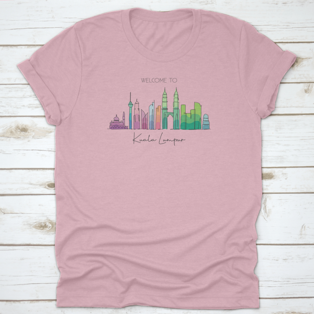 A stylish t-shirt featuring a minimalist single line drawing of the Kuala Lumpur city skyline, showcasing iconic buildings.