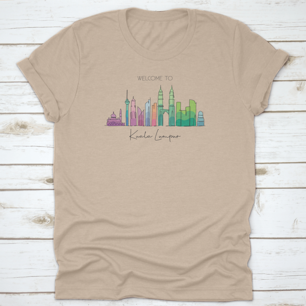 A stylish t-shirt featuring a minimalist single line drawing of the Kuala Lumpur city skyline, showcasing iconic buildings.