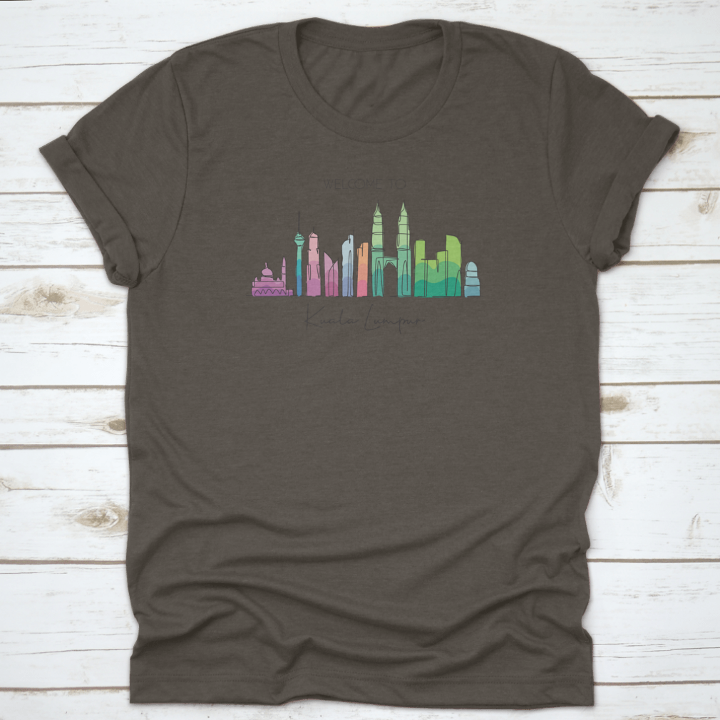 A stylish t-shirt featuring a minimalist single line drawing of the Kuala Lumpur city skyline, showcasing iconic buildings.