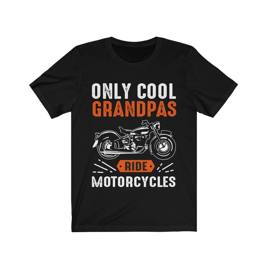 A soft cotton unisex t-shirt featuring the slogan 'Only Cool Grandpas Ride Motorcycles' in bold vinyl print, perfect for motorcycle enthusiasts.