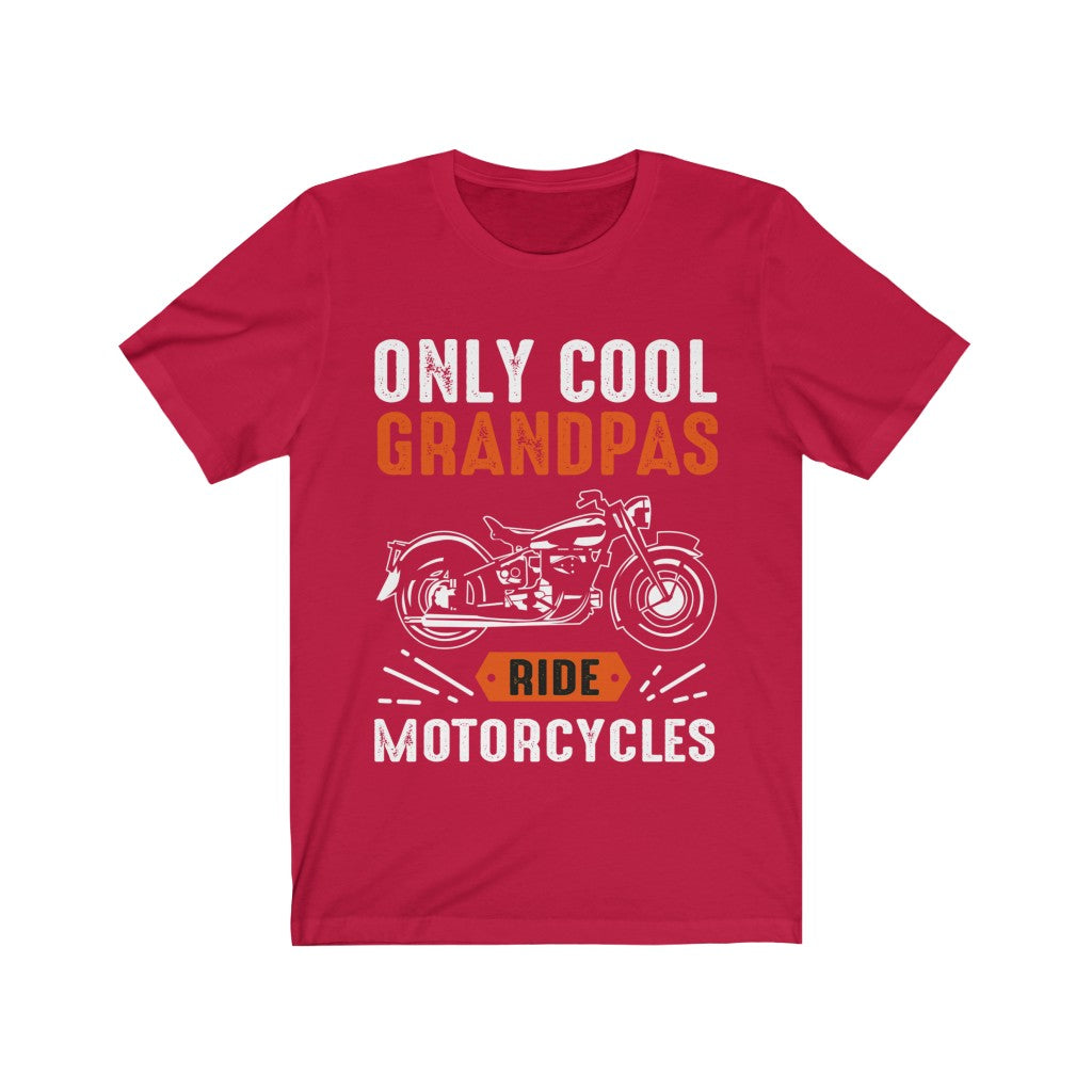 A soft cotton unisex t-shirt featuring the slogan 'Only Cool Grandpas Ride Motorcycles' in bold vinyl print, perfect for motorcycle enthusiasts.