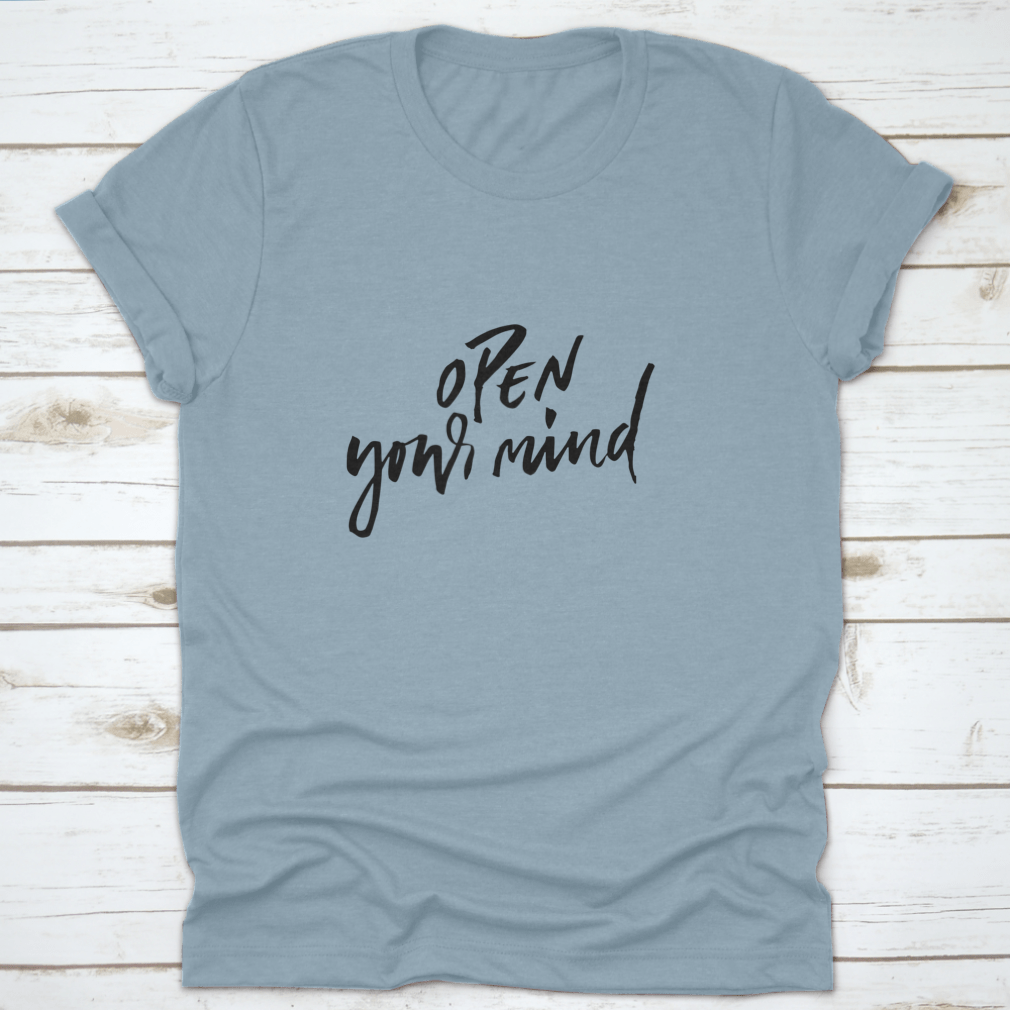 A motivational t-shirt featuring the quote 'Open Your Mind', made from soft cotton fabric, displayed on a neutral background.