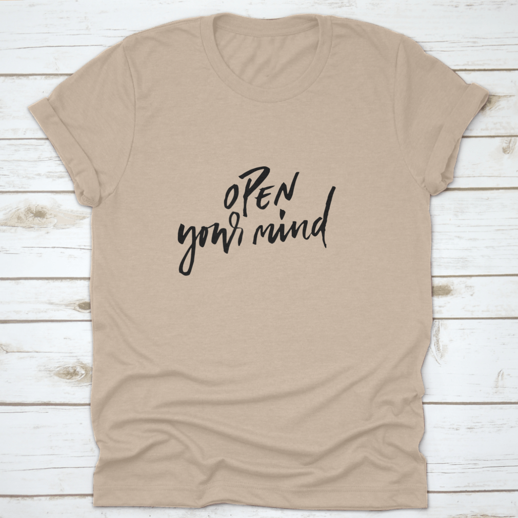 A motivational t-shirt featuring the quote 'Open Your Mind', made from soft cotton fabric, displayed on a neutral background.