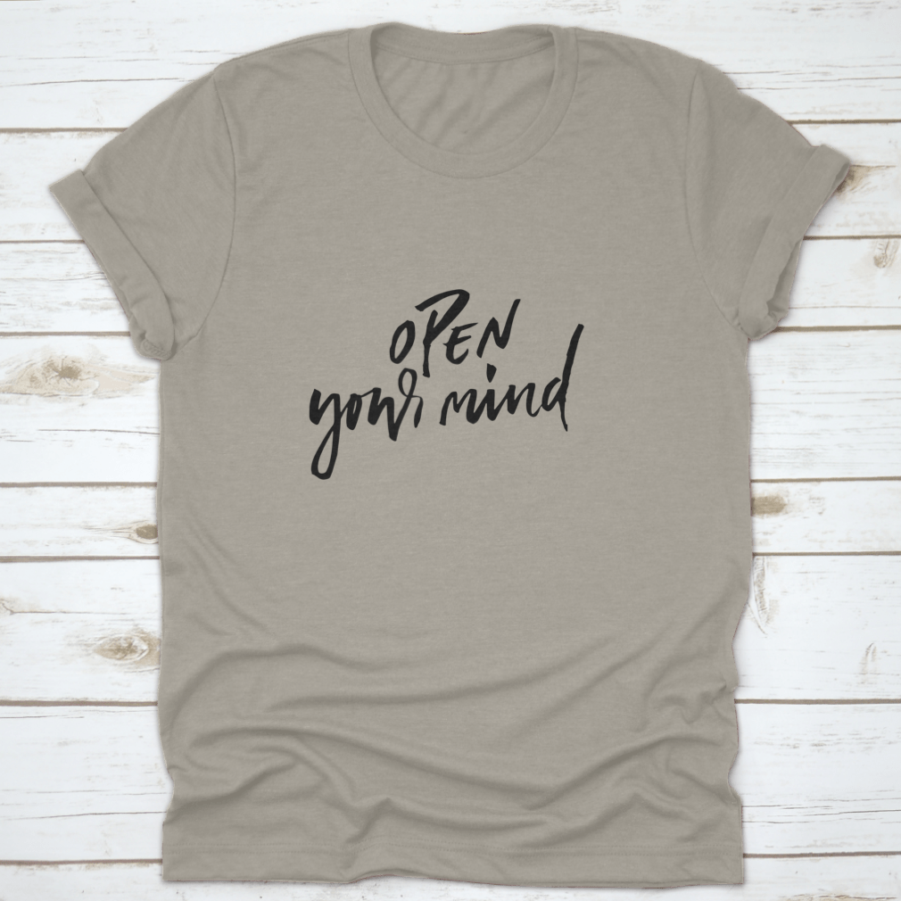 A motivational t-shirt featuring the quote 'Open Your Mind', made from soft cotton fabric, displayed on a neutral background.