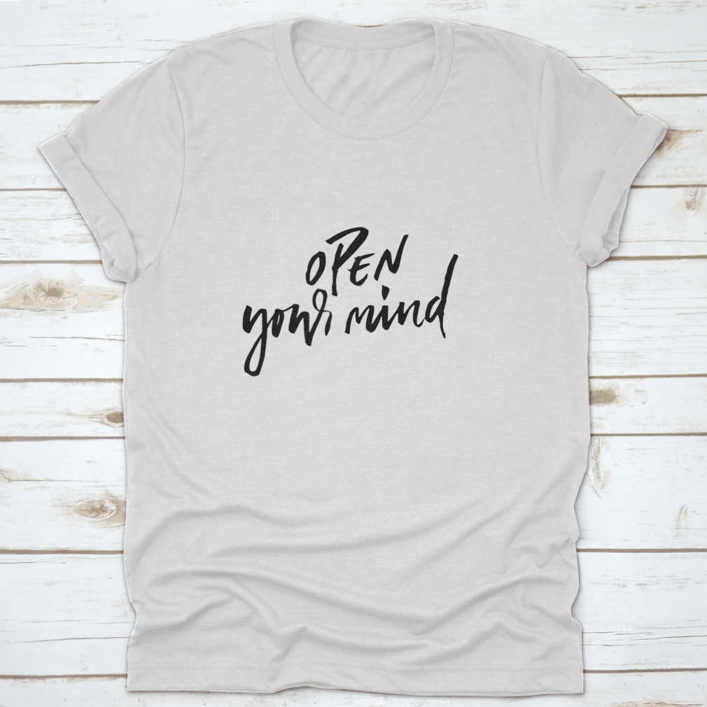 A motivational t-shirt featuring the quote 'Open Your Mind', made from soft cotton fabric, displayed on a neutral background.