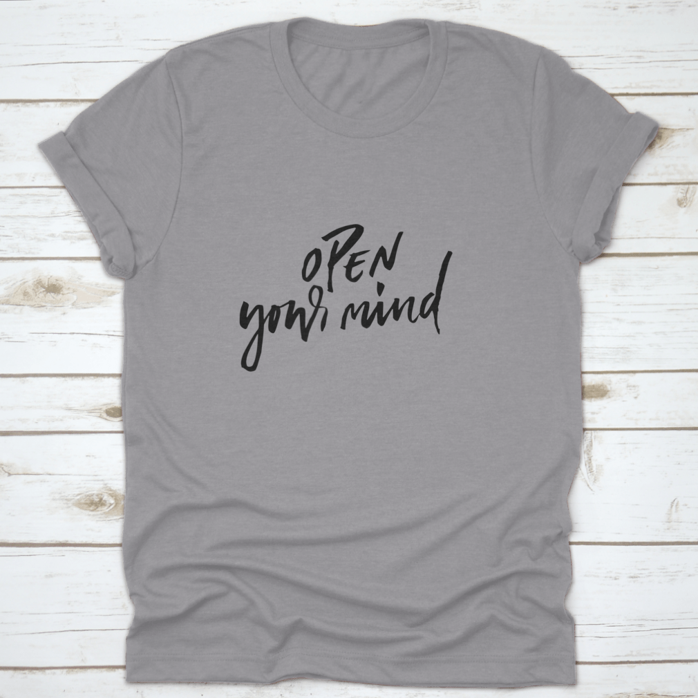 A motivational t-shirt featuring the quote 'Open Your Mind', made from soft cotton fabric, displayed on a neutral background.
