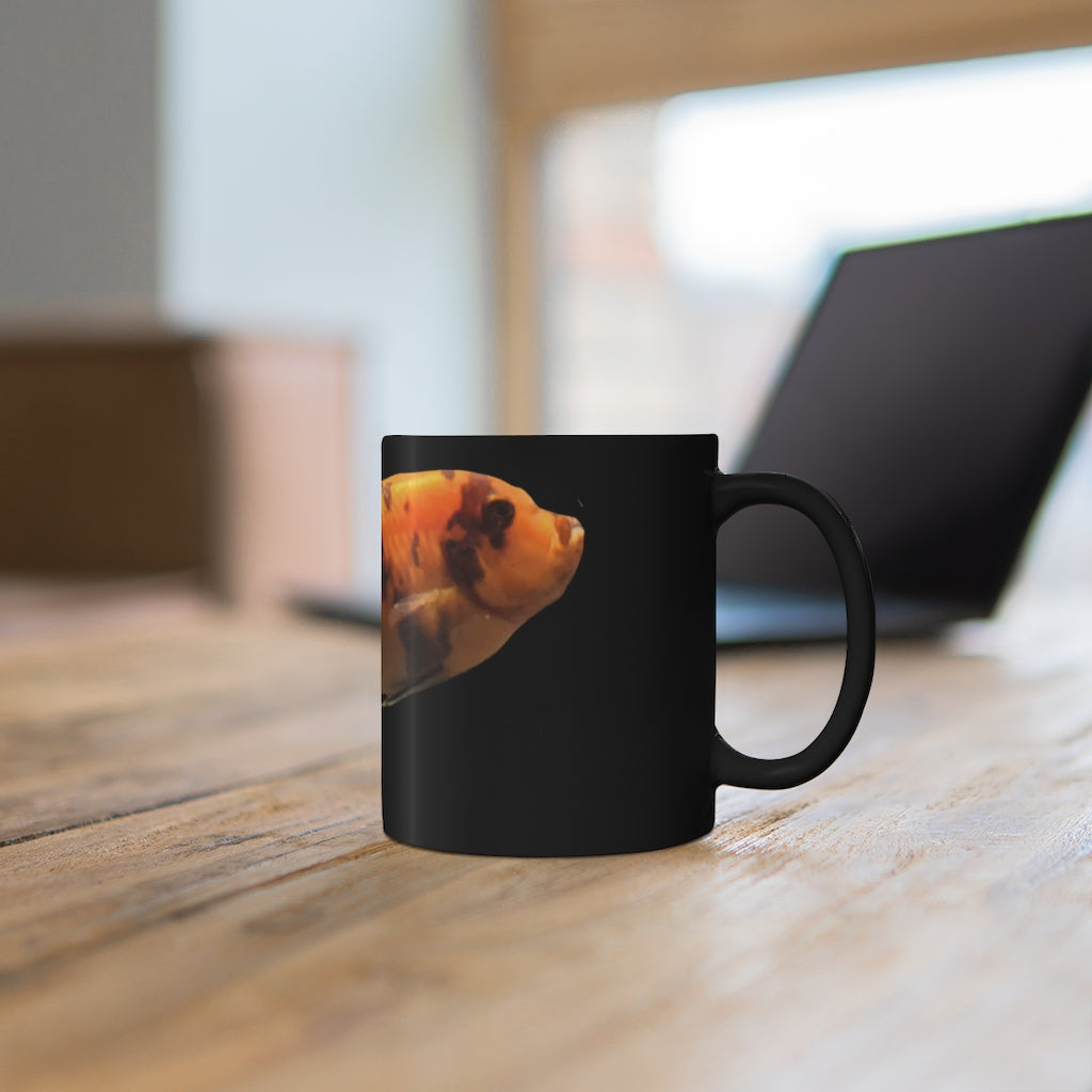 Orange Fish 11oz black ceramic mug with a C-handle, perfect for coffee, tea, or hot chocolate.