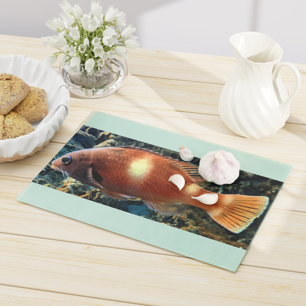 Orange Fish Cutting Board made of tempered glass with rubber dots for stability, featuring a vibrant fish design.